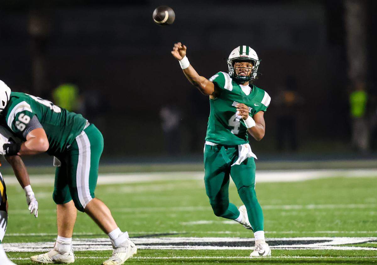 Dutch Fork Silver Foxes quarterback Ethan Offing (4) passes against the Irmo Yellow Jackets during their game at Dutch Fork High School, 11/8/24.