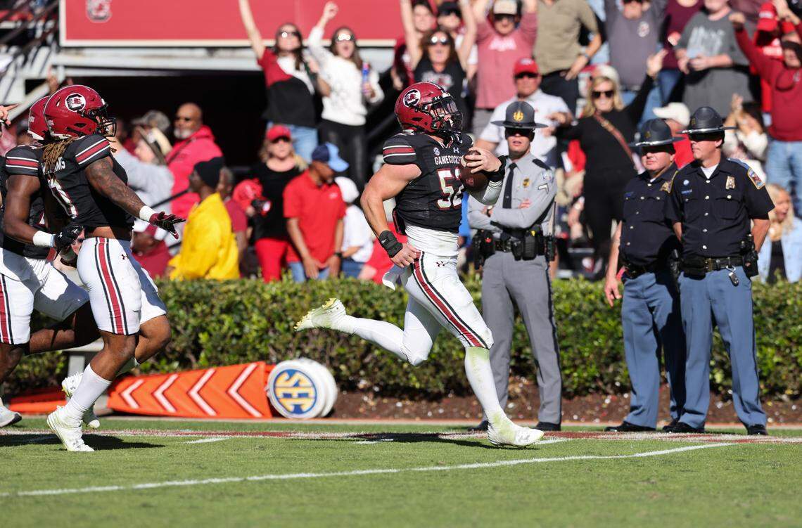 South Carolina linebacker Stone Blanton (52) returns an interception for a touchdown during the second half of the Gamecocks’ game at Williams-Brice Stadium in Columbia on Saturday, November 4, 2023.