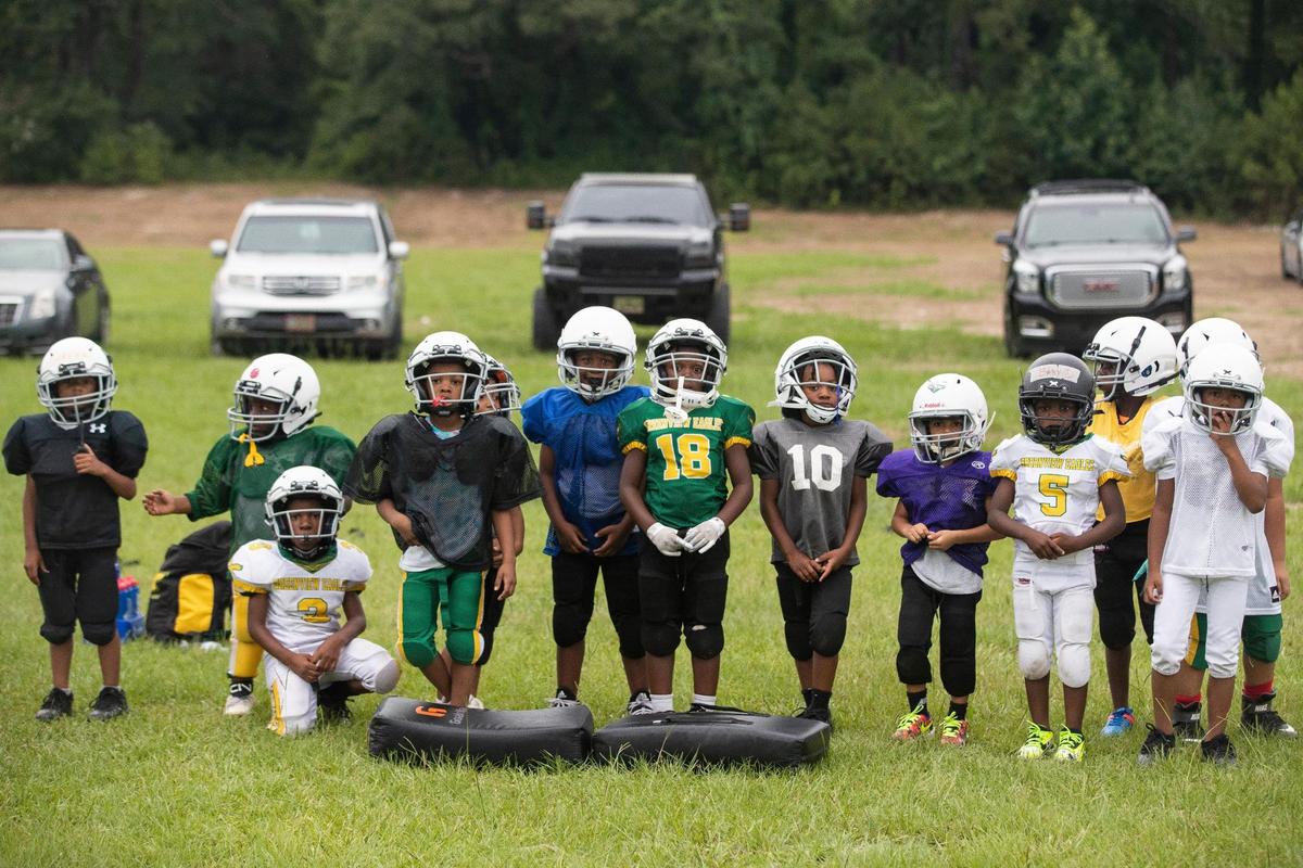 The Greenview Eagles practice football at the former W.G. Sanders Middle School in Columbia, South Carolina on Thursday, July 7, 2022. The program has teams for children from six to twelve years old.