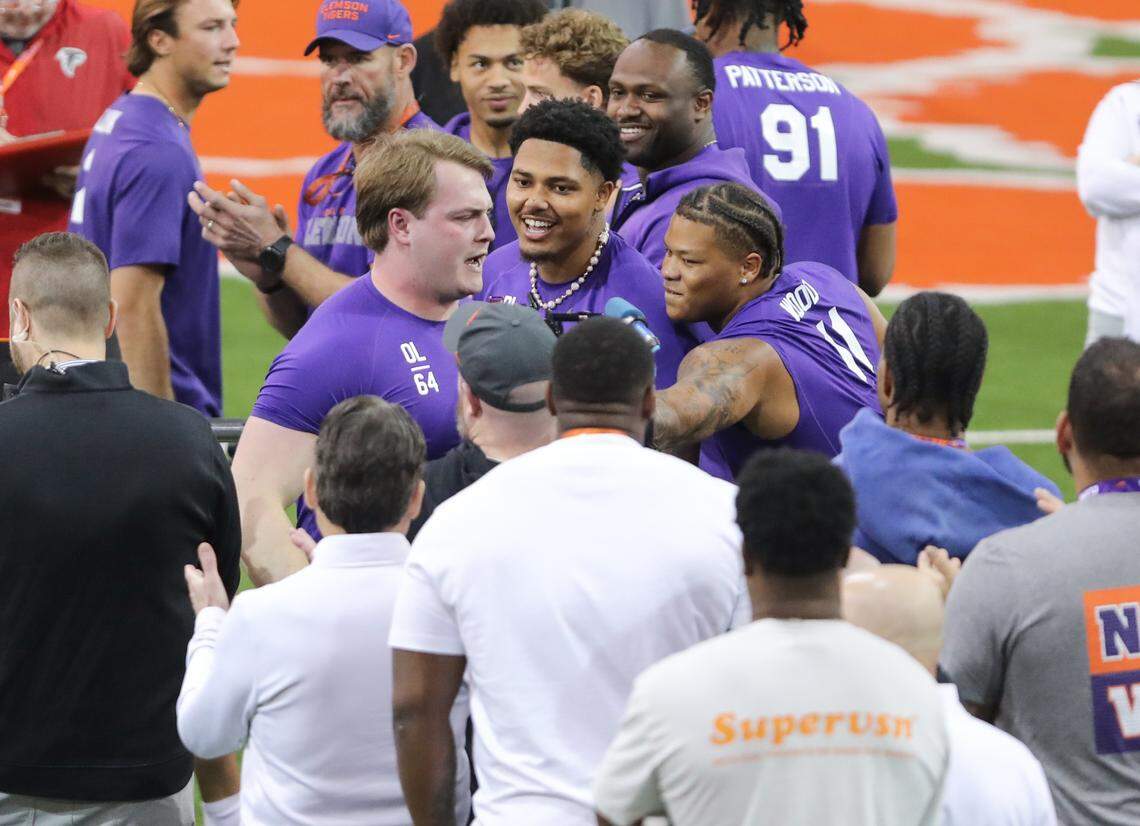 Clemson teammates congratulate offensive lineman Walker Parks (middle left) after he finishes bench pressing during the team’s 2026 NFL pro day at the Poe Indoor Practice Facility on March 12.