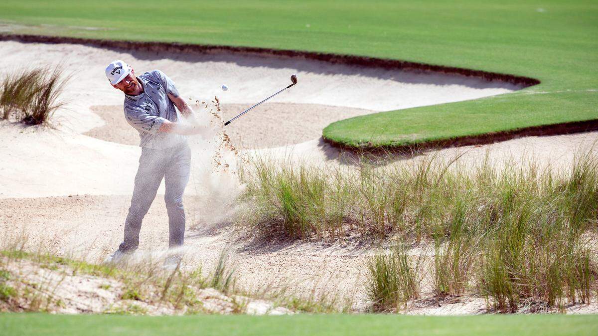 Tyler McCumber hits out of the bunker on the 12th green during the second round of the Palmetto Championship golf tournament in Ridgeland, S.C., Friday, June 11, 2021. (AP Photo/Stephen B. Morton)