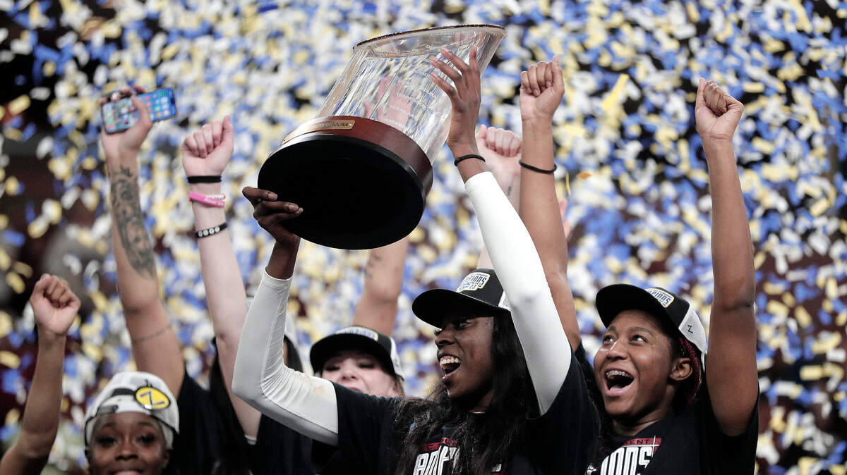 South Carolina Laeticia Amihere and Aliyah Boston celebrate Sunday’s SEC tournament championship win at Bon Secours Wellness Arena in Greenville.