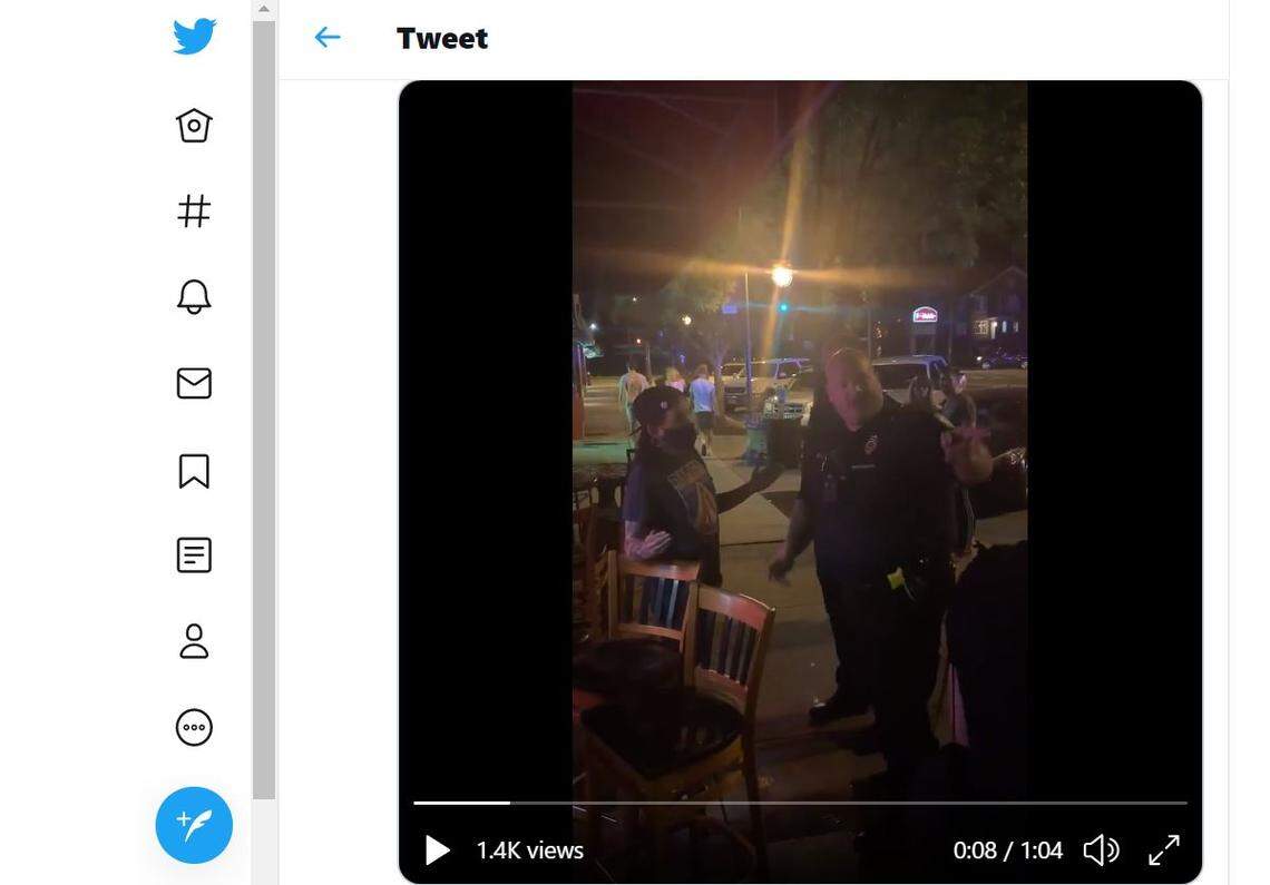 A Columbia police officer argues with people in Five Points.