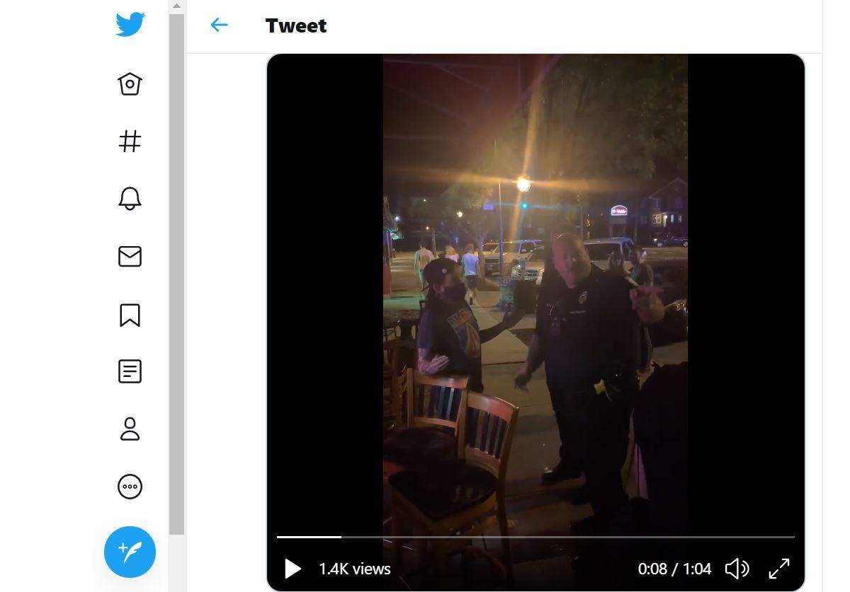 A Columbia police officer argues with people in Five Points.