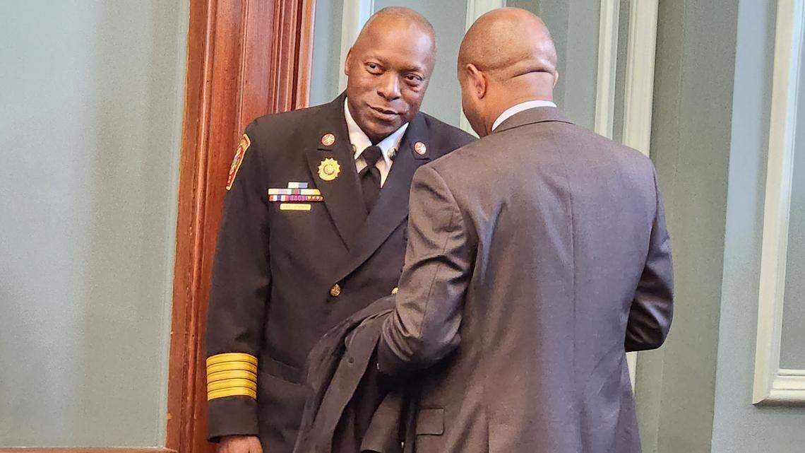 Longtime Columbia Fire Chief Aubrey Jenkins, left, chats with Richland County Council Chairman Overture Walker ahead of a June 22, 2023 press conference at Columbia City Hall.
