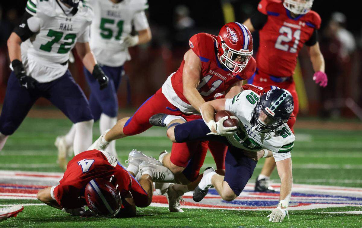 Jackson Ross (11) of Hammond brings down Julian Hughes (20) of Heathwood Hall during their game at Hammond on Nov. 14, 2025.