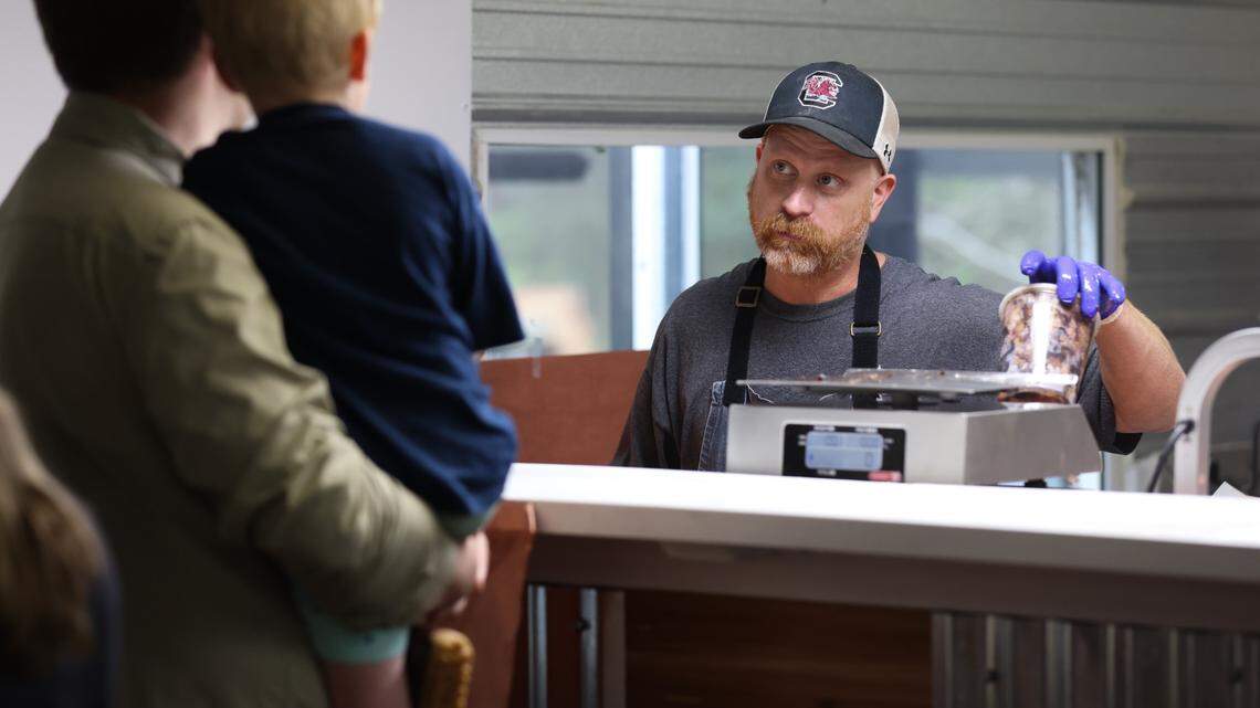 Robbie Robinson, owner of City Limits Barbeque, takes orders at his West Columbia restaurant on Saturday, March 23, 2024. Robinson is a semifinalist for Best Chef in the southeast in the 2025 James Beard Foundation Awards.