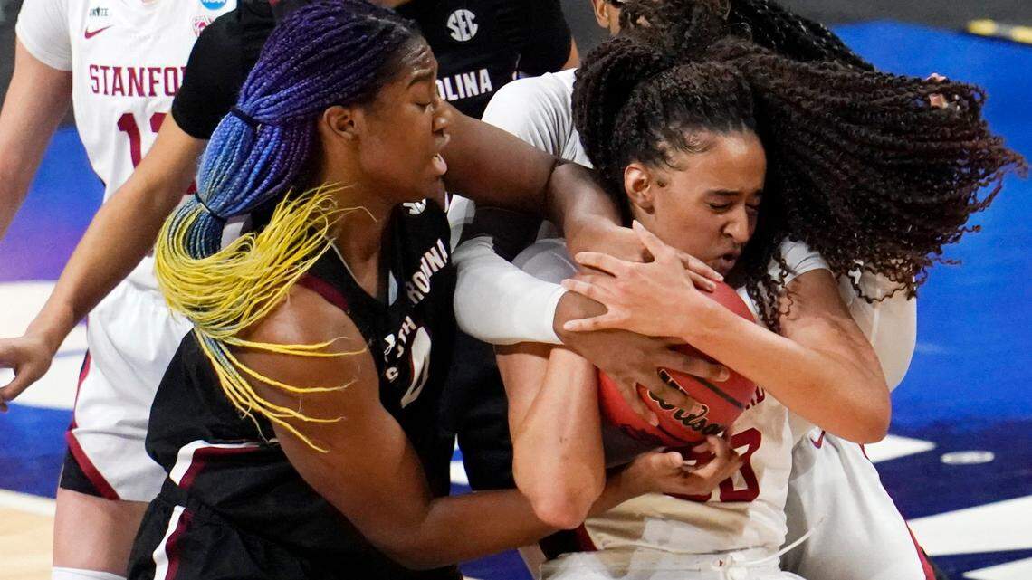 South Carolina forward Aliyah Boston, left, fights for a rebound with Stanford guard Haley Jones (30) during the first half of a women’s Final Four NCAA college basketball tournament semifinal game Friday, April 2, 2021, at the Alamodome in San Antonio.