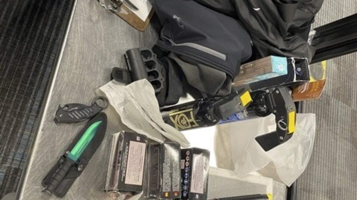 A former U.S. Marine found fall 2022 trying to board an airplane at Columbia Metropolitan Airport with smoke grenades and other weapons has been sentenced to a year in prison.