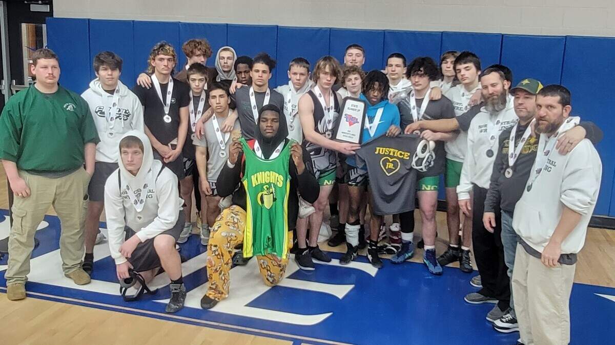 North Central wrestling team poses for a team photo after Saturday’s Class 2A championship match.