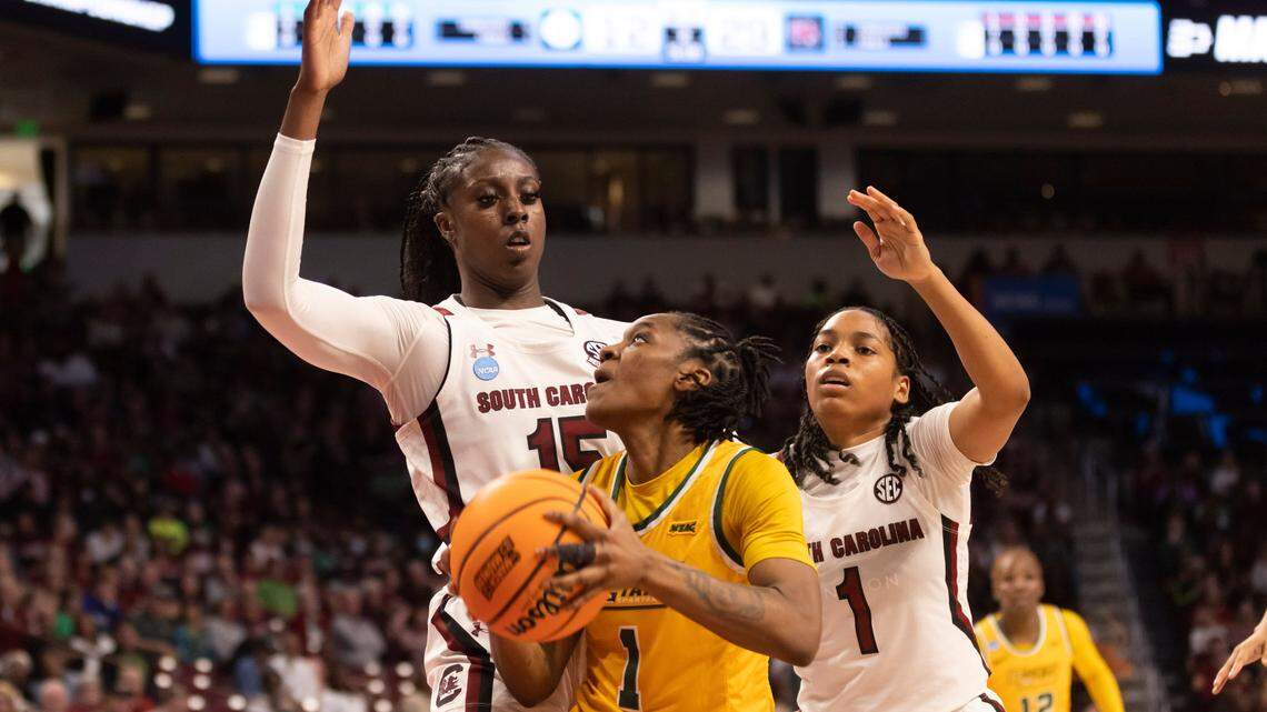 South Carolina Gamecocks forward Laeticia Amihere (15) and guard Zia Cooke (1) defend Norfolk State Spartans guard Deja Francis (1) during the first round of the 2023 NCAA Tournament at Colonial Life Arena in Columbia on Friday, March 17, 2023.