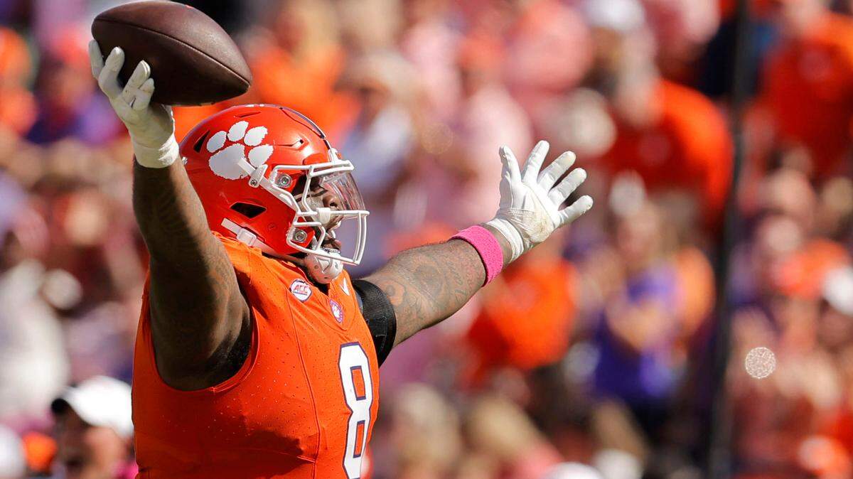 Clemson defensive tackle Tre Williams (8) celebrates after picking up a Virginia fumble during second-half action in Clemson, S.C. on Saturday, Oct. 19, 2024.