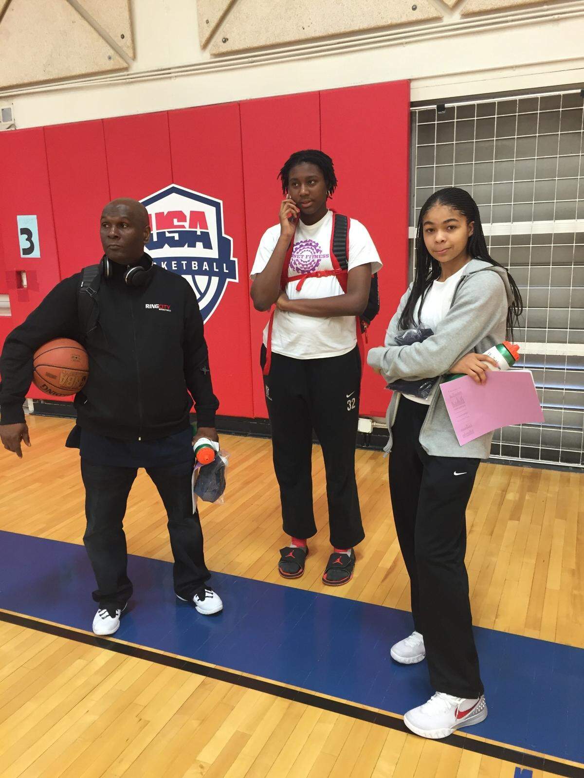 AAU coach Walter Welsh, left, Aliyah Boston, middle, and Jordan Nixon at the USA Basketball trials.