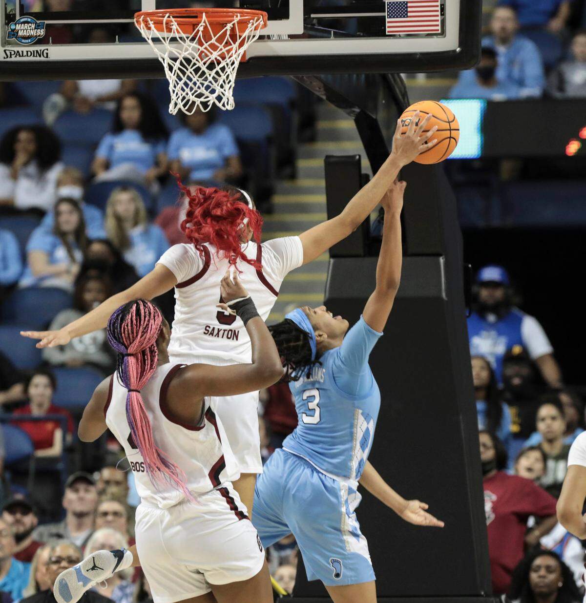 South Carolina’s Victaria Saxton (5) blocks a shot by North Carolina’s Kennedy Todd-Williams (3) during the second half of action during the Sweet 16 game at the Greensboro Coliseum on Friday, March 25, 2022.