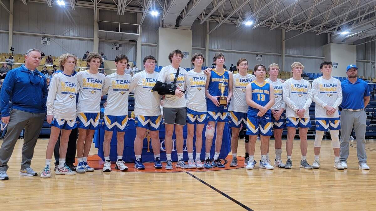 The Richard Winn boys basketball team and coaches pose for a photo after Saturday’s SCISA Class A boys championship game on Feb. 25, 2023.