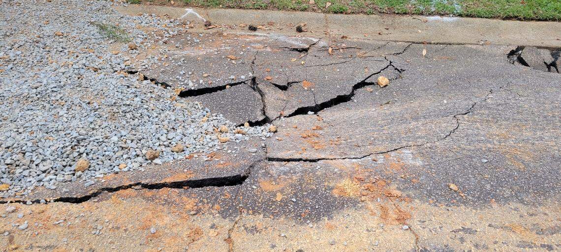 Damage to the road on Willow Bend Court after a struck water line opened a sinkhole in the roadway on Sept. 11, 2024.