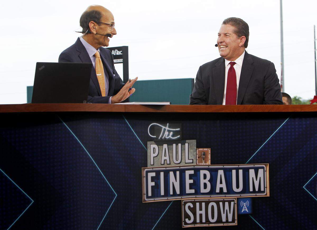 Paul Finebaum, left, talks with Ray Tanner, the South Carolina athletic director, in 2015.