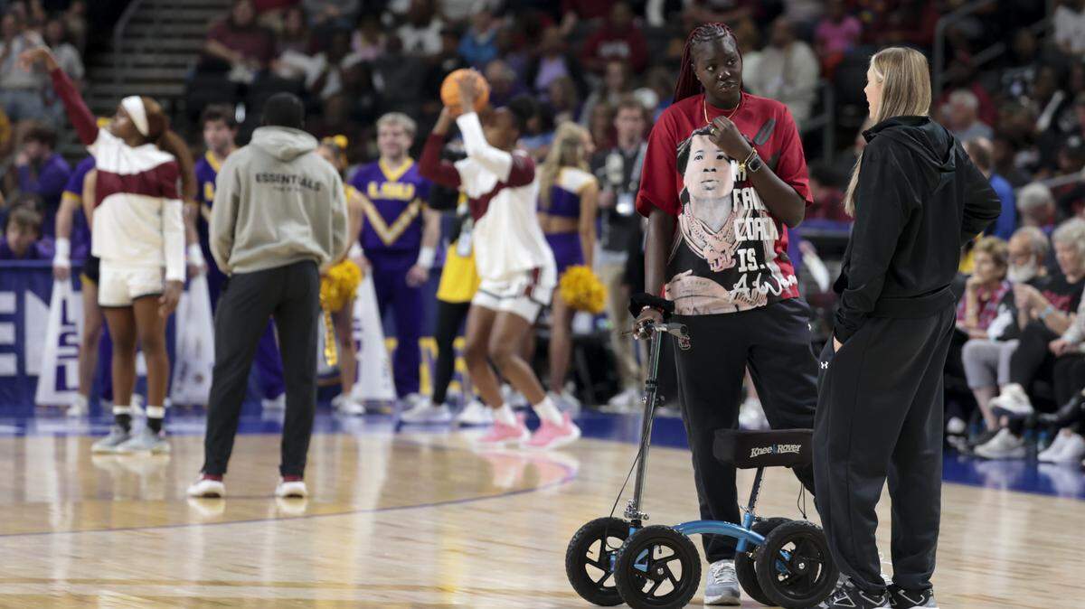 South Carolina's Adhel Tac (15) and Chloe Kitts talk while the Gamecocks warmup for their women's basketball game in the SEC Tournament, against LSU at the Bon Secours Wellness Arena on Saturday, March 7, 2026.