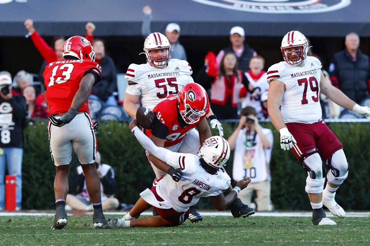 Georgia defensive lineman Xzavier McLeod (94) forcing a fumble vs. Massachusetts
