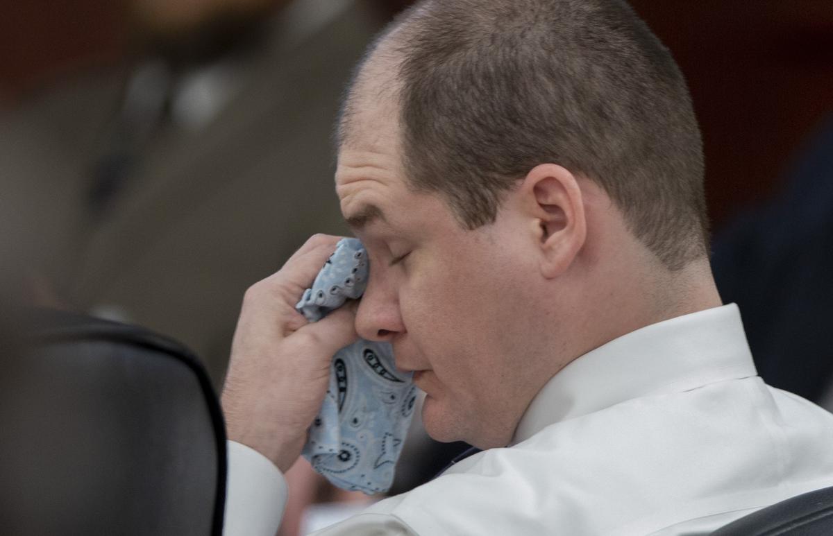 Tim Jones wipes his eyes during his death penalty trial Friday as an FBI agent describes how Jones confessed to killing his five children in 2014. 5/17/19