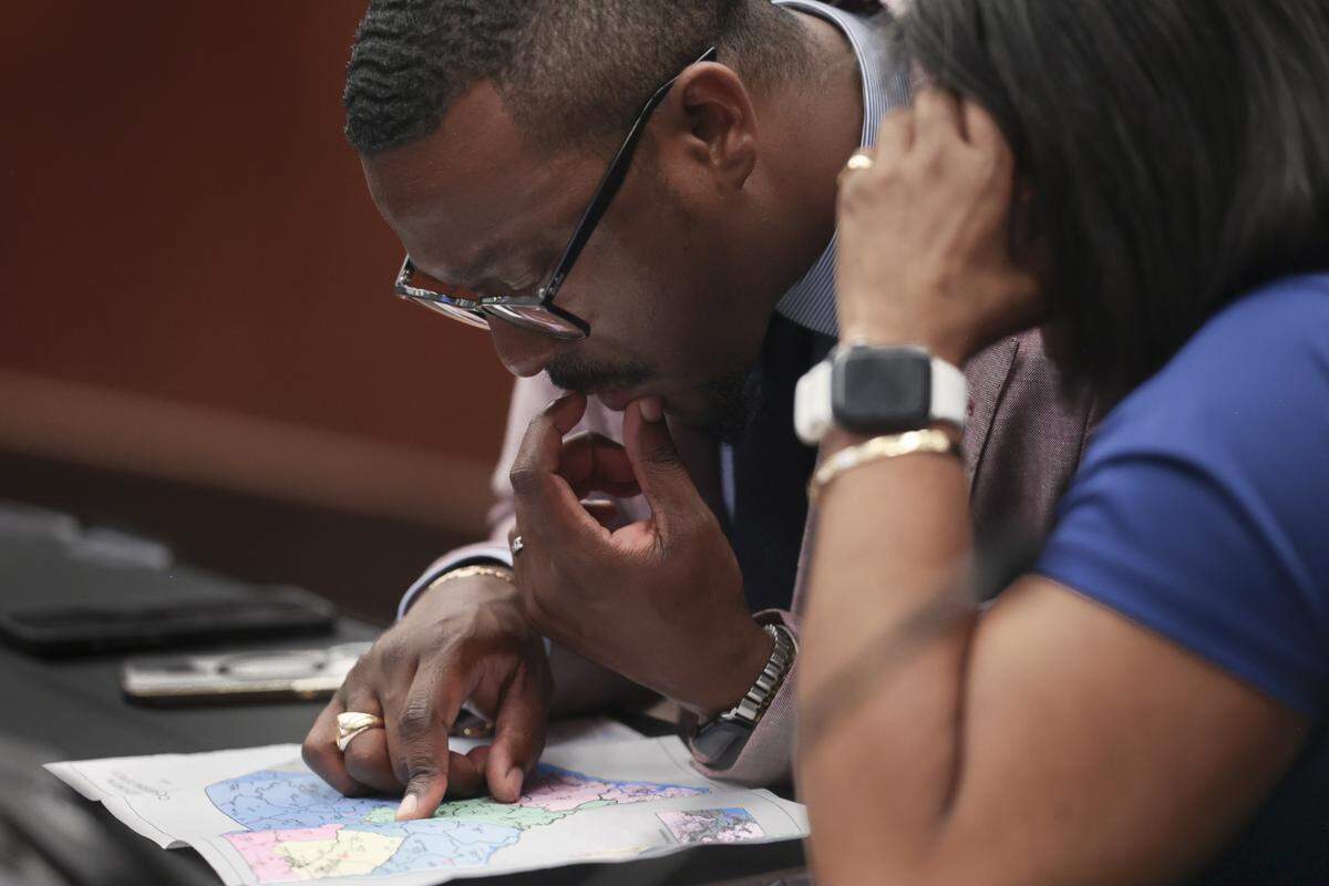 State Rep. Hamilton Grant, D-Richland and State Rep. Annie McDaniel, D-Fairfield, look at a proposed redistricting map during a hearing of the constitutional laws committee on Friday, May 8, 2026.