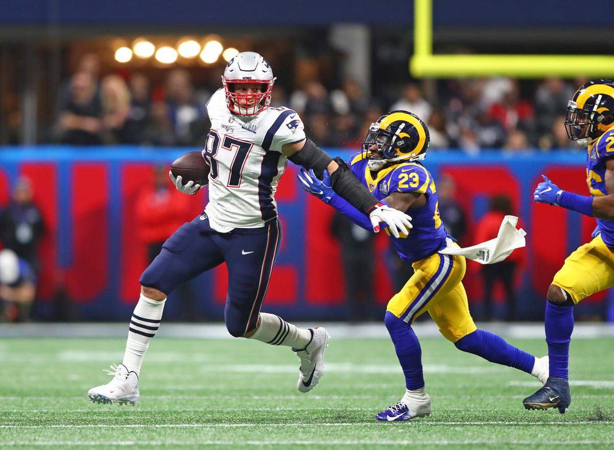 Feb 3, 2019; Atlanta, GA, USA; New England Patriots tight end Rob Gronkowski (87) runs the ball against Los Angeles Rams defensive back Nickell Robey-Coleman (23) in the first quarter in Super Bowl LIII at Mercedes-Benz Stadium. Mandatory Credit: Mark J. Rebilas-USA TODAY Sports