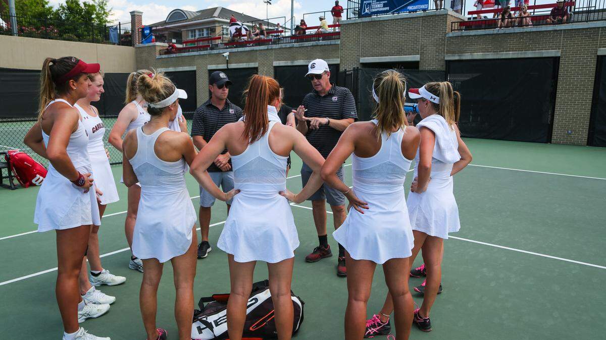 South Carolina women’s tennis coach Kevin Eppley talks to his team before the single’s matches during the first round of the NCAA Regionals women’s tennis tournament in Columbia, SC.