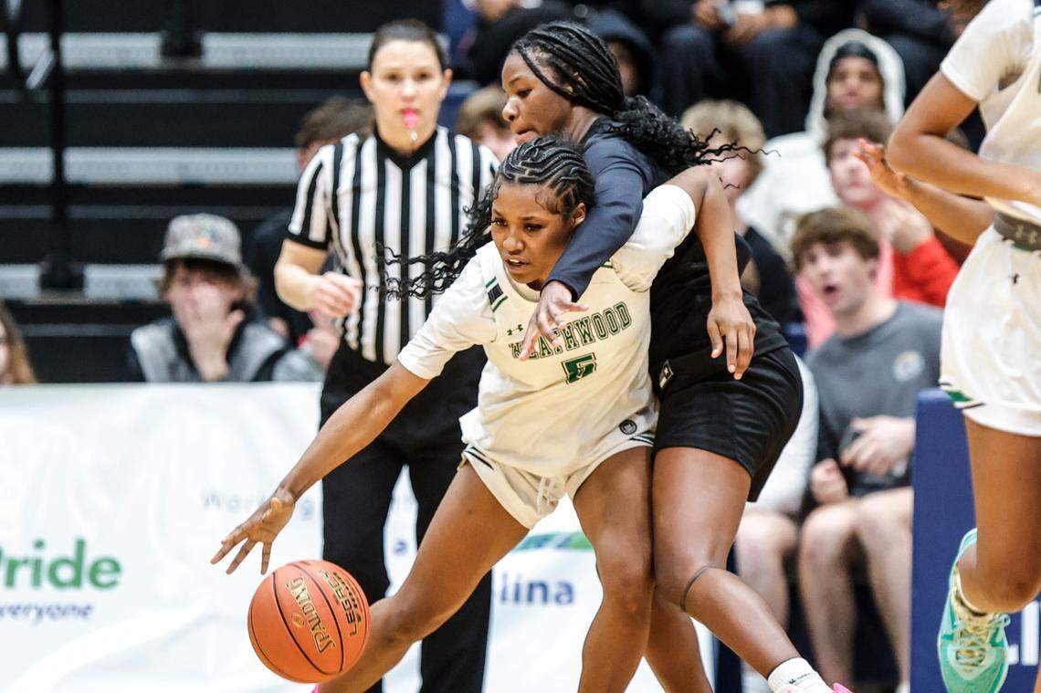 Northwood’s Alayah Birch (15) wraps up Heathwood’s Sabrina Monsanto (5) during the second half of action in the Class 4A SC Independent Schools Association championship at the Sumter Civic Center on Friday, Feb. 23, 2024