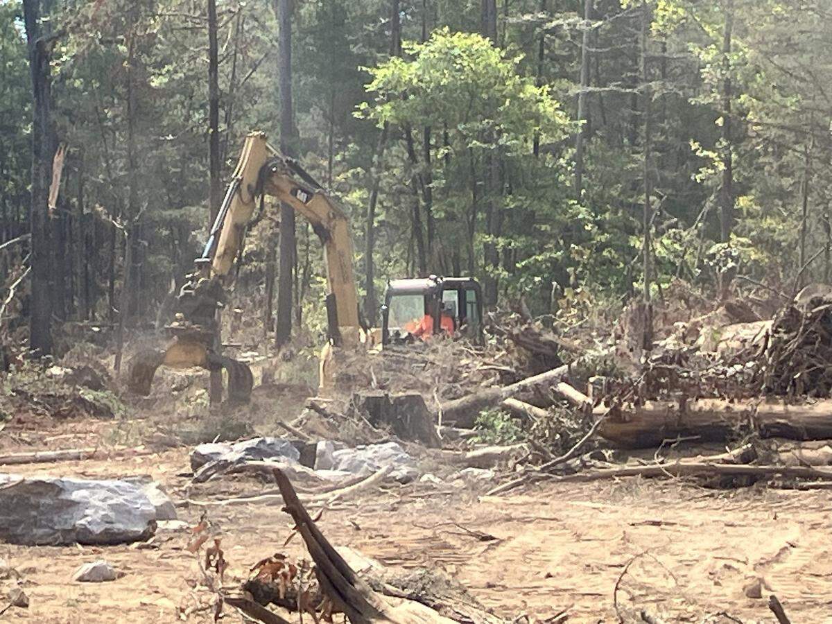 Workers use heavy machinery as part of a stream restoration project in the Sumter National Forest of Chester County. The work is being done to repair eroded streams as part of a plan to offset environmental damage from the Scout Motor Vehicles project in Richland County. Critics say the stream work is expensive, difficult and is resulting in the loss of a maturing forest. (photo taken Sept. 24, 2025)