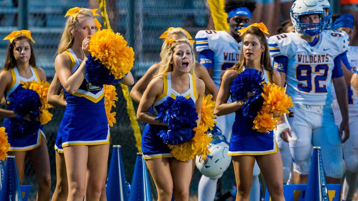 Lexington Wildcats cheerleaders cheer during the game Friday between Lexington High School and Irmo High School at Irmo High School