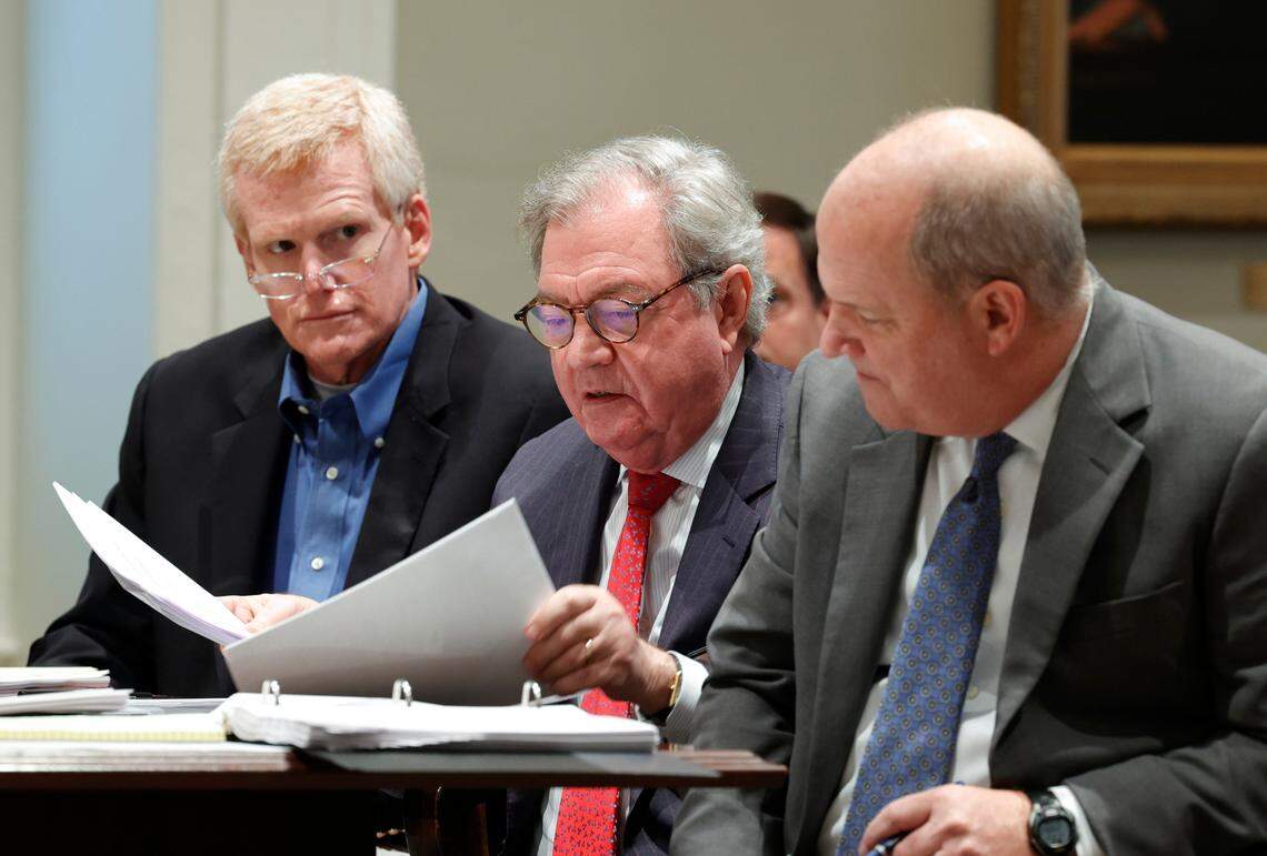 Alex Murdaugh sits in the Colleton County Courthouse with his legal team including Dick Harpootlian (center) and Jim Griffin (right) as his attorneys discuss motions in front of Judge Clifton Newman in a December hearing.Murdaugh’s trial for murder is scheduled to begin Jan. 23, 2023 in Walterboro.