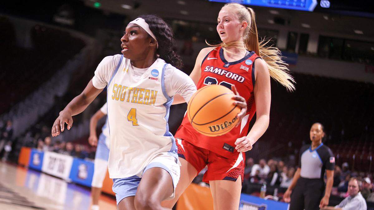 Southern's Joceyln Tate (4) drives the ball against Samford during their NCAA Tournament First Four game Thursday at Colonial Life Arena.