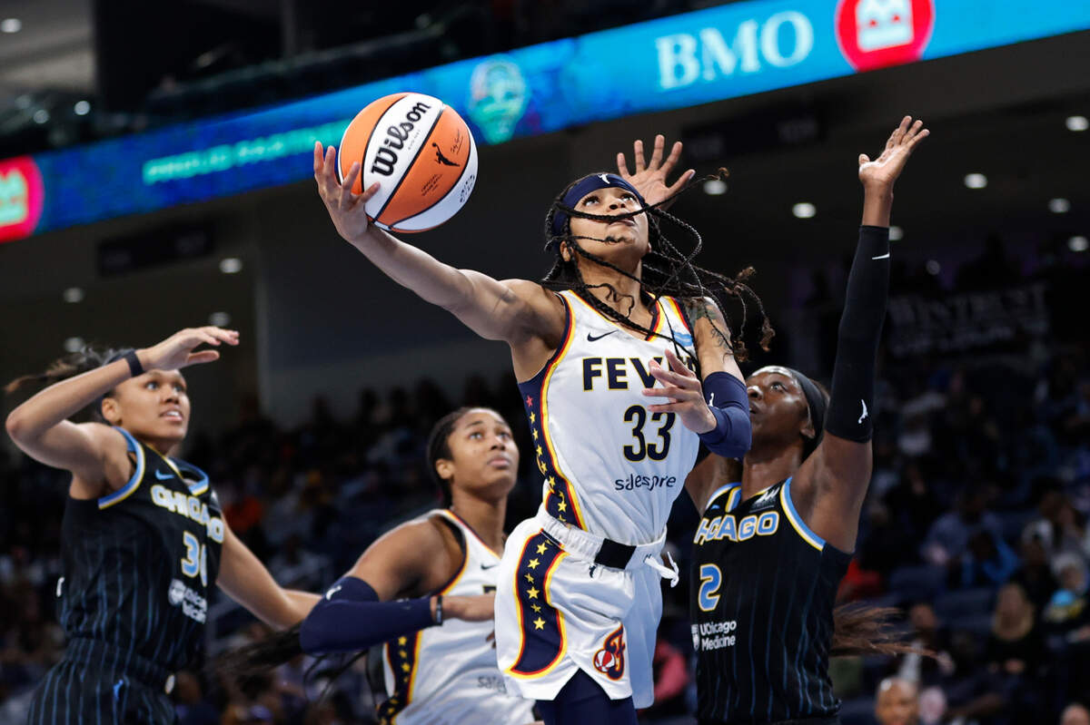 May 24, 2022; Chicago, Illinois, USA; Indiana Fever guard Destanni Henderson (33) goes to the basket against Chicago Sky guard Kahleah Copper (2) during the second half at Wintrust Arena. Mandatory Credit: Kamil Krzaczynski-USA TODAY Sports