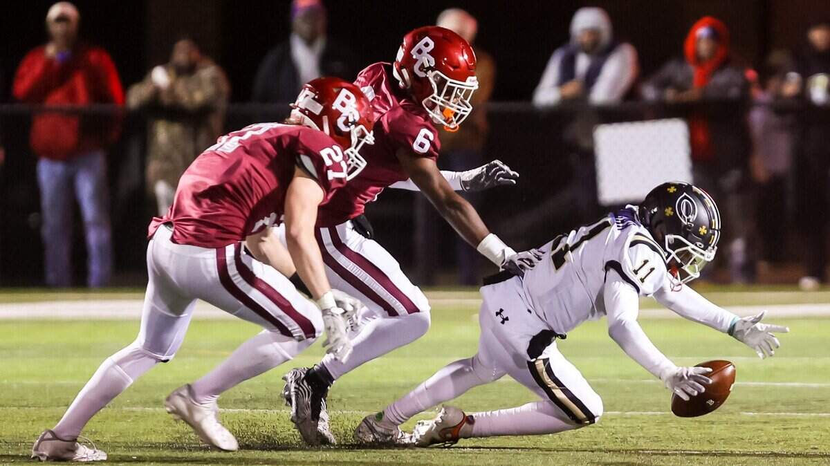 Camden Bulldogs defensive back Dylan Locklear (11) recovers a blocked punt against the Brookland-Cayce Bearcats in a playoff game Friday, Nov. 19, 2021 at Brookland-Cayce High School in Cayce, SC.