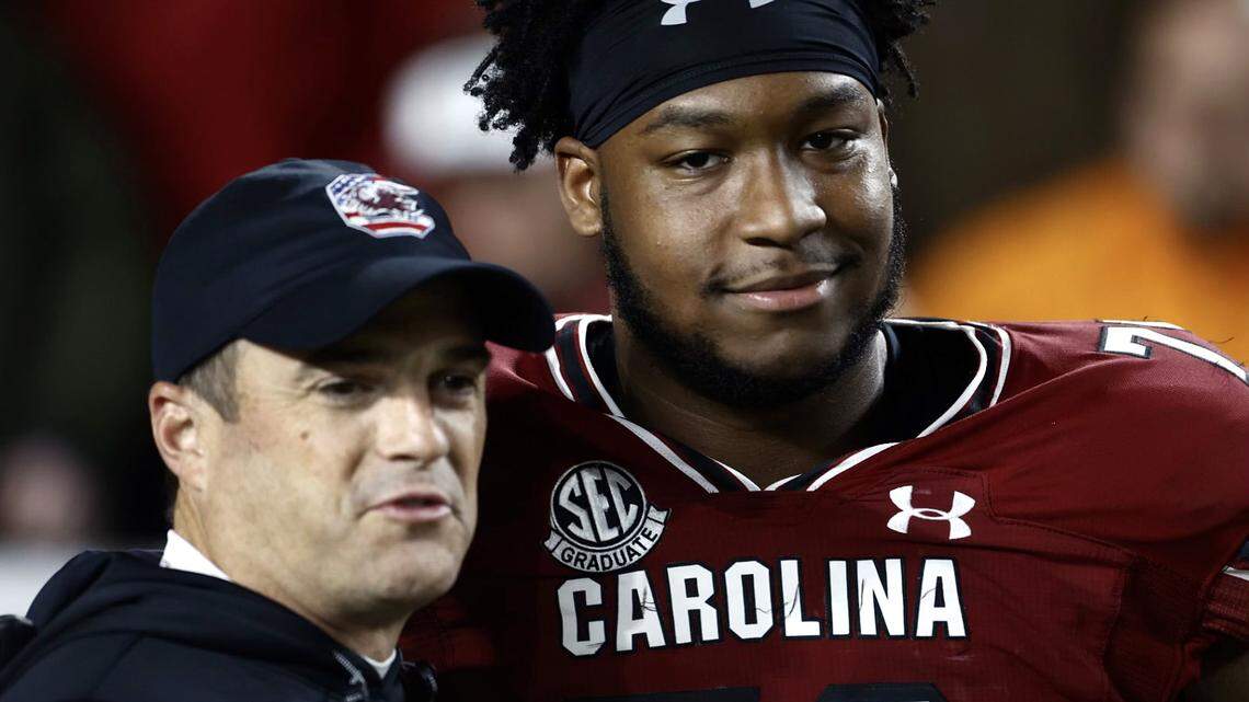 South Carolina head coach Shane Beamer and Dylan Wonnum during Saturday’s Senior Day ceremony.