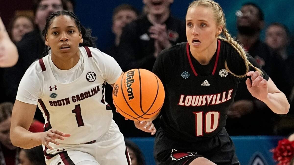 South Carolina’s Zia Cooke and Louisville’s Hailey Van Lith go after a loose ball during the first half of a college basketball game in the semifinal round of the Women’s Final Four NCAA tournament Friday, April 1, 2022, in Minneapolis. (AP Photo/Eric Gay)