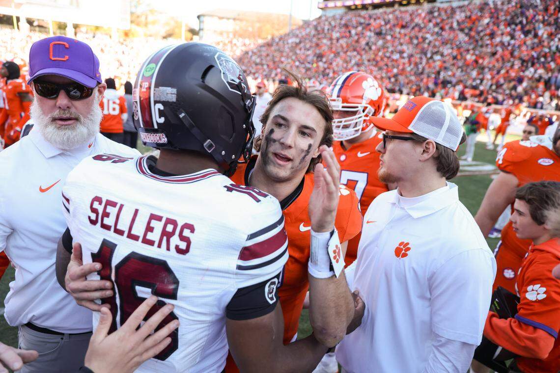 South Carolina quarterback LaNorris Sellers (16) is congratulated by Clemson quarterback Cade Klubnik (2) after the Palmetto Bowl between at Memorial Stadium in Clemson on Saturday, November 30, 2024.