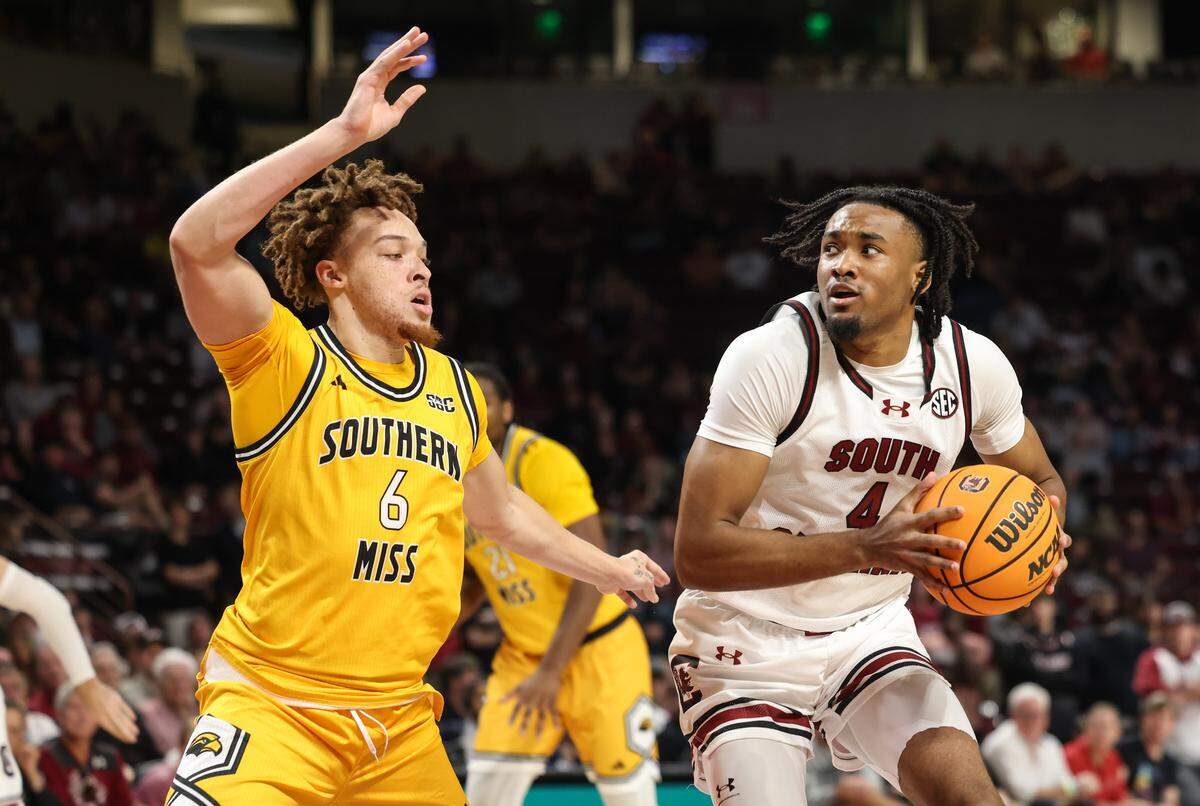 South Carolina guard Kobe Knox (4) is defended by Southern Mississippi guard Robert Cowherd (6) during the first half of action of the men's basketball game against Southern Mississippi at Colonial Life Arena on Sunday, Nov. 9, 2025.