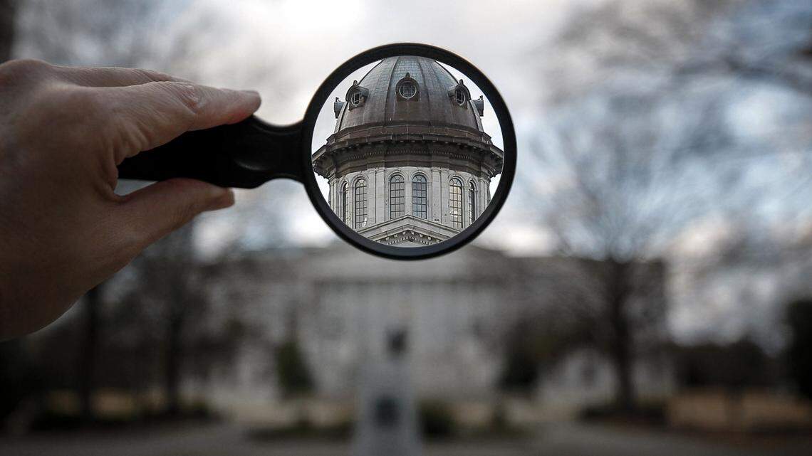 A photo illustration showing the South Carolina State House through a magnifying glass. (Travis Bell/STATEHOUSE CAROLINA)