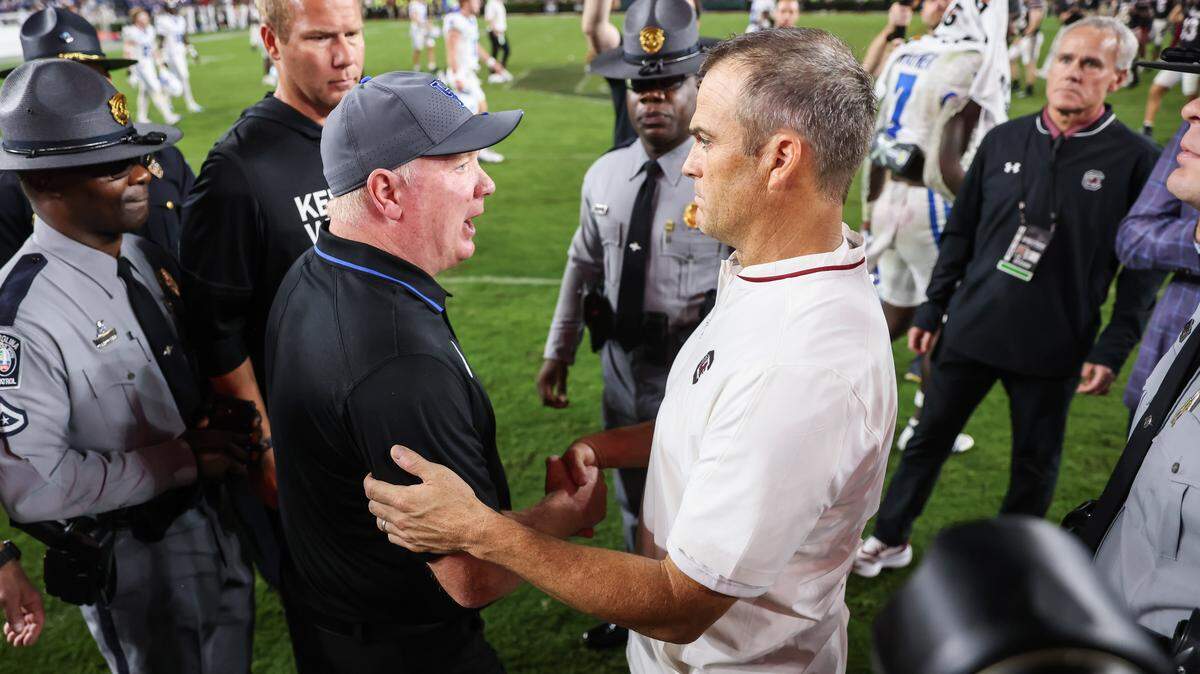 Kentucky head coach Mark Stoops and South Carolina head coach Shane Beamer meet at midfield following the Gamecocks’ game against Kentucky at Williams-Brice Stadium in Columbia on Saturday, September 27, 2025.