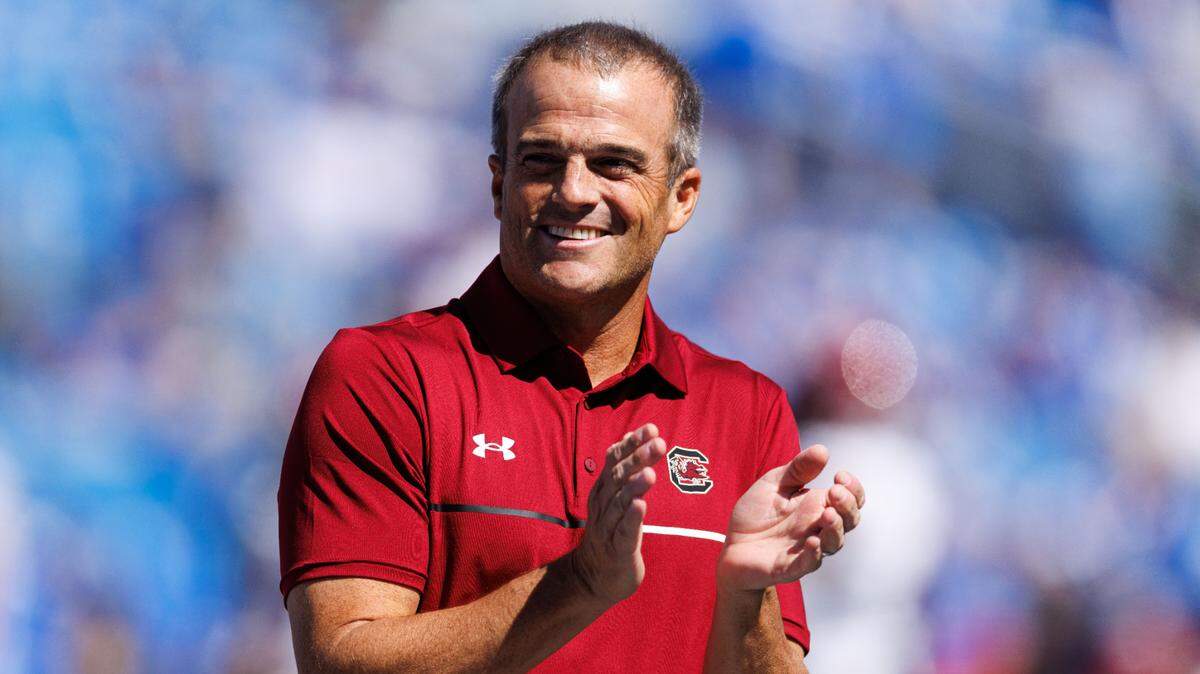 Sep 7, 2024; Lexington, Kentucky, USA; South Carolina Gamecocks head coach Shane Beamer claps during warm-ups before the game against the Kentucky Wildcats at Kroger Field. Mandatory Credit: Jordan Prather-Imagn Images