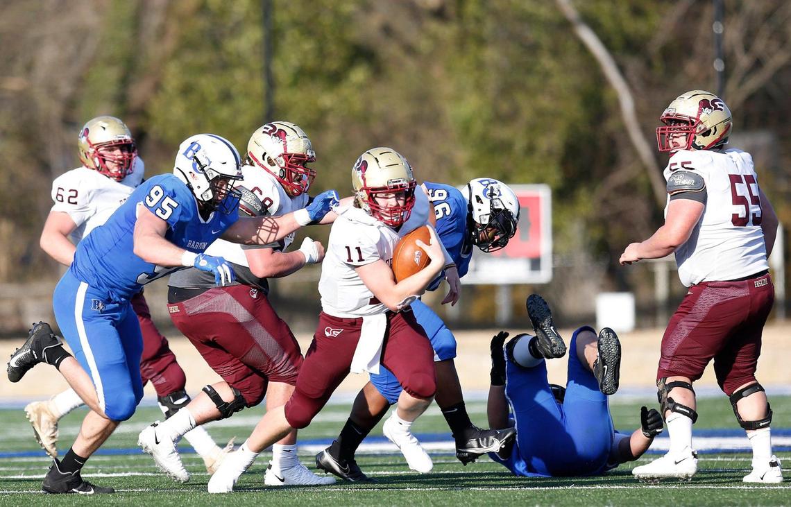 Erskine quarterback Craig Pender (11) gets chased by Barton Bulldogs defensive end Christian Brown (95) in the fourth quarter of the game Saturday.