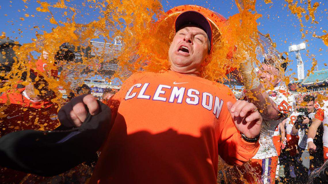 Clemson Tigers head coach Dabo Swinney is doused after beating the Kentucky Wildcats in the Gator Bowl at EverBank Stadium.