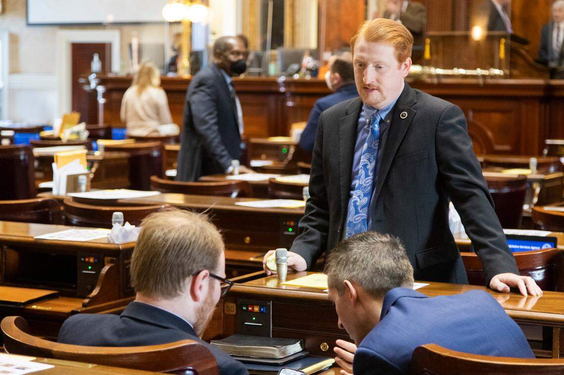 State Rep. Josiah Magnuson R-Spartanburg speaks with colleagues at the South Carolina State House on January 11, 2022.