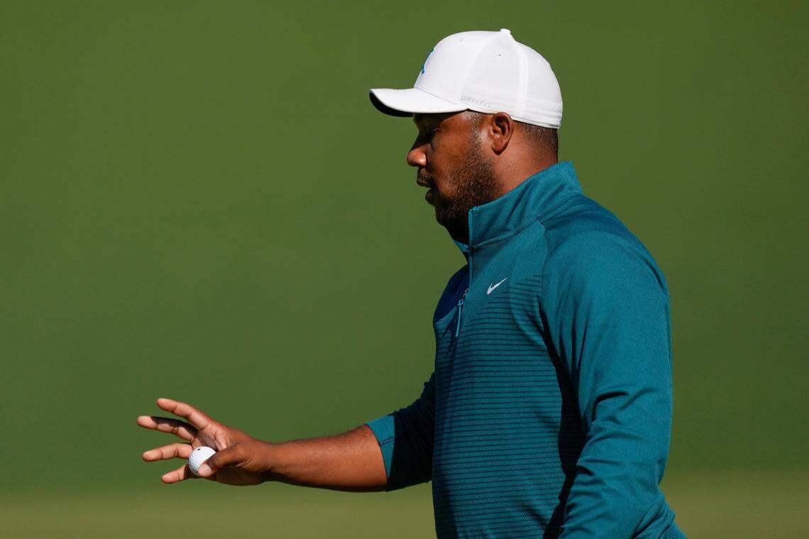 Harold Varner III holds up his ball after a birdie on the second hole during the second round at the Masters golf tournament on Friday, April 8, 2022, in Augusta, Ga. (AP Photo/Matt Slocum)