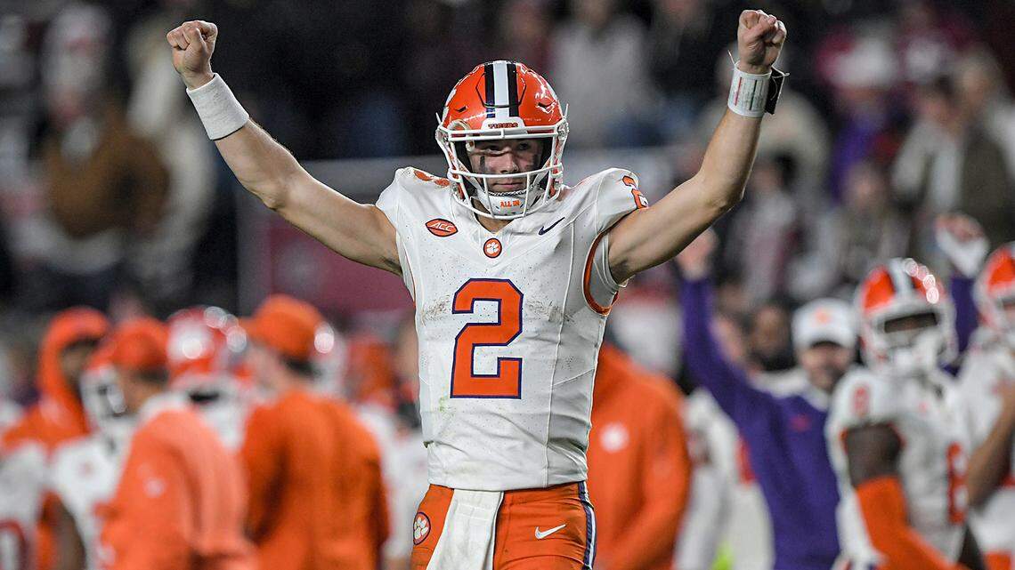 Nov 25, 2023; Columbia, South Carolina, USA; Clemson Tigers quarterback Cade Klubnik (2) raises his arms as time runs out against the South Carolina Gamecocks at Williams-Brice Stadium. Clemson won 16-7. Mandatory Credit: Ken Ruinard-USA TODAY Sports
