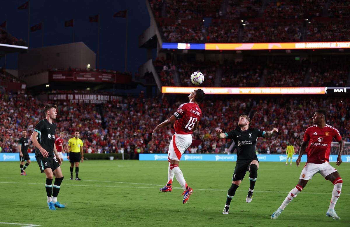 Manchester United midfielder Casemiro (18) goes up for a header during the Rivals in Red International Friendly soccer match between Manchester United and Liverpool in Columbia on Saturday, August 3, 2024.