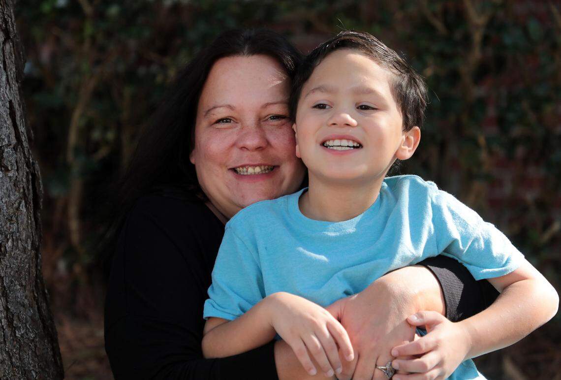 Crystal Reyes, left, and her son, 8-year-old Lucas Reyes, at their home in Rock Hill.