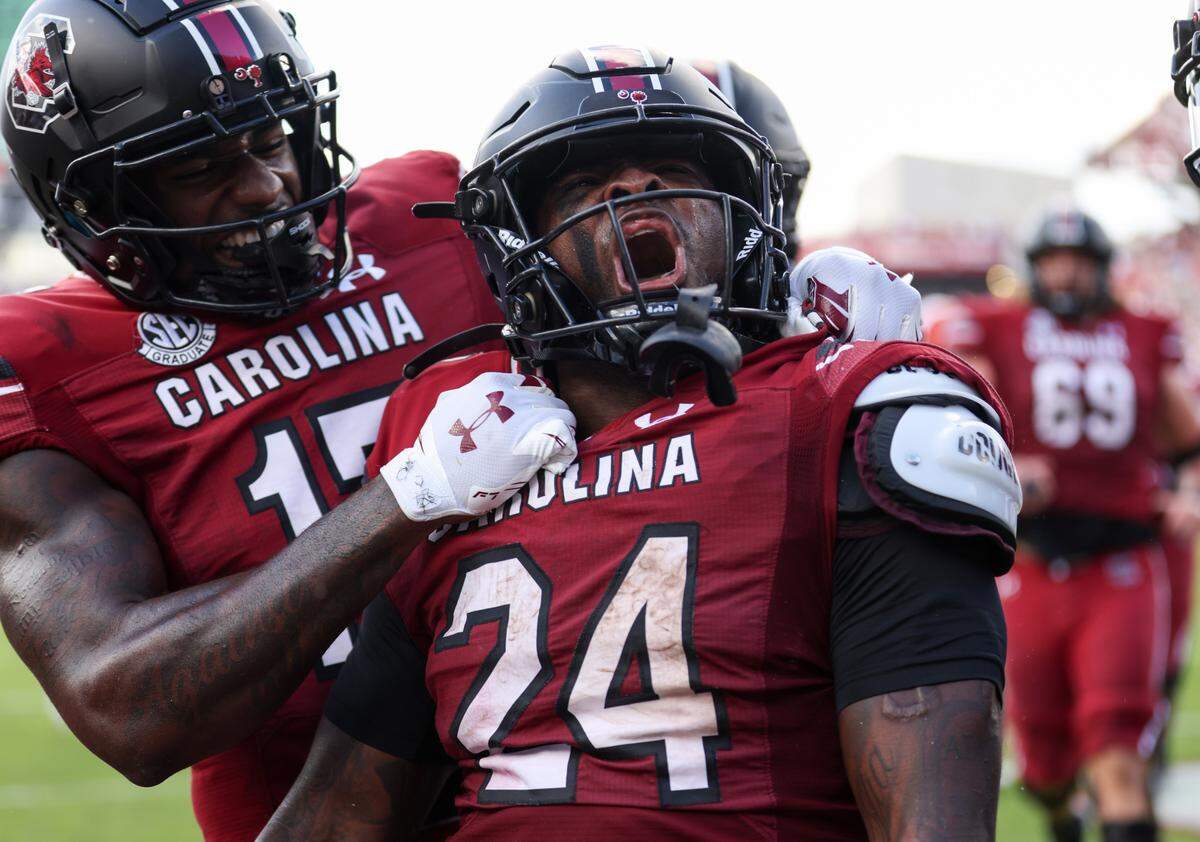 South Carolina running back Mario Anderson (24) celebrates a touchdown with teammate wide receiver Xavier Legette (17) during the second quarter of South Carolina’s game at Williams-Brice Stadium in Columbia on Saturday, October 14, 2023.
