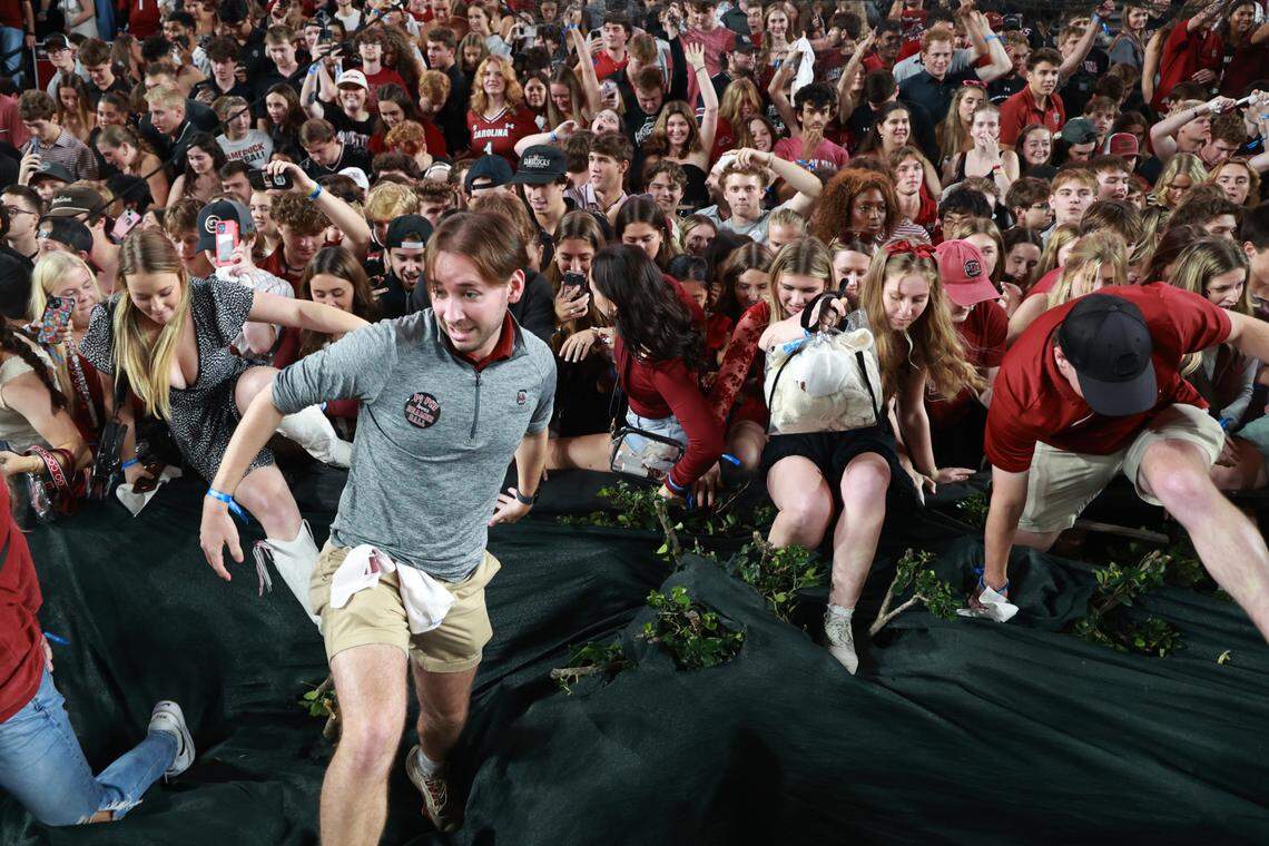 South Carolina fans rush the field after their team beat Texas A&M at Williams-Brice Stadium on Saturday, November 2, 2024.